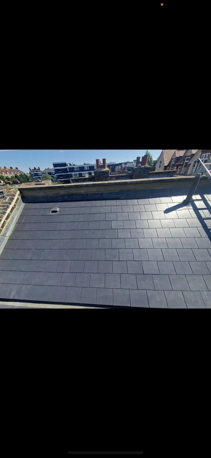 New slate flat-section roof on a London townhouse