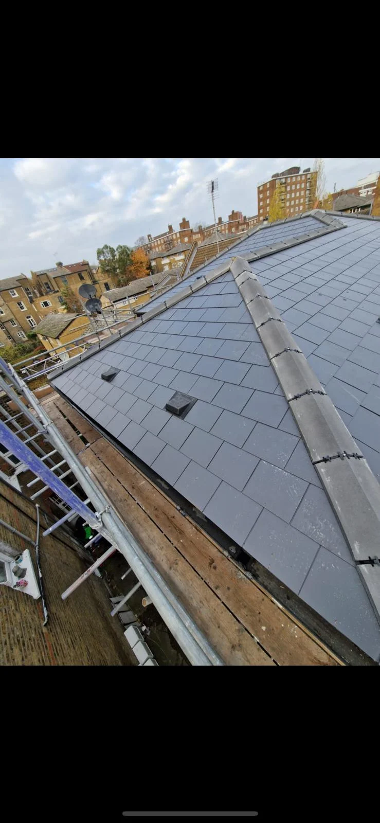 Completed slate hip roof with lead hip details